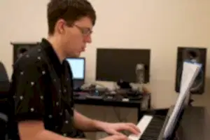 Teenager playing piano at Besharp Music School, Adelaide, showcasing talent and passion for musical expression.