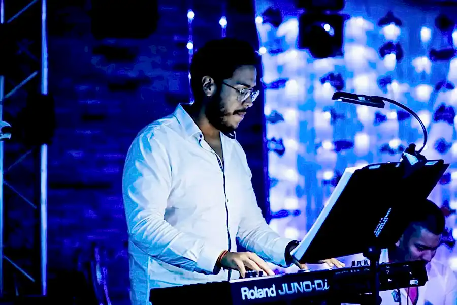 Keyboard teacher at Besharp Music School, Adelaide, instructing students with passion and fostering musical growth.